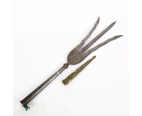 A 19th century Middle Eastern steel Trident head, length 50cm, and a relief cast-brass dagger scabbard 