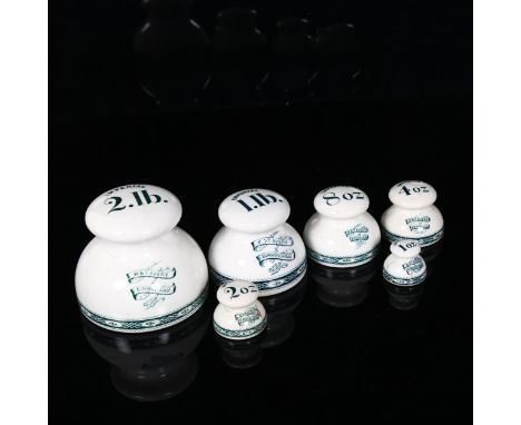 A graduated set of 6 pottery grocer's shop weights, by W & T Avery of Birmingham, comprising 2lb, 1lb, 8oz, 4oz, 2oz and 1oz,