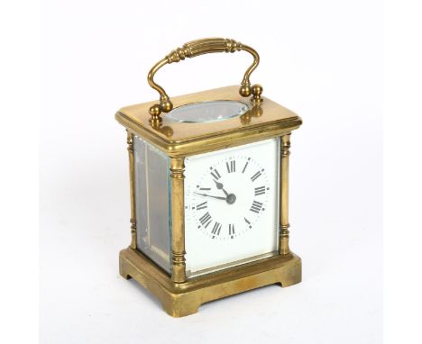 A small brass-cased carriage clock, with white enamel dial and Roman numeral hour markers, case height 9.5cm, not currently w