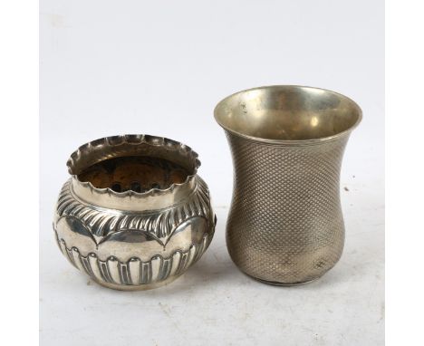 An embossed silver bowl, and an engine turned silver beaker (2) 