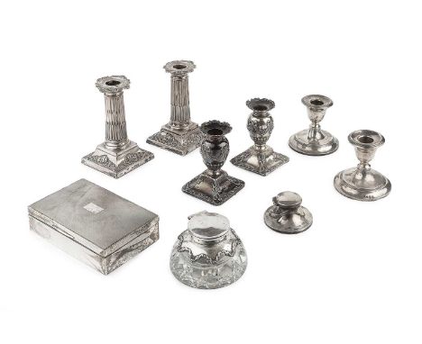 A pair of Edwardian silver candlesticks, of Corinthian design, on weighted bases by Harrison Bros &amp; Howson, Sheffield 190