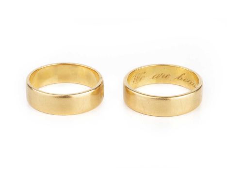 Two 18ct gold wedding bands, each of flat section form, the larger band with interior inscription, ring sizes K and L (2)Size
