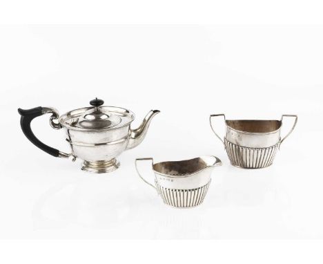 A George V silver bachelor's teapot, with girdled body, and ebonised handle and knop, by William Hutton &amp; Sons Ltd, Londo