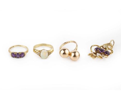 Three dress rings, comprising an opal and diamond dress ring, stamped '14CT', an amethyst three stone ring, 9ct gold mounted,