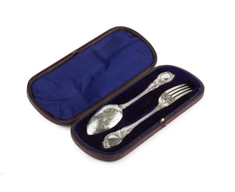A mid Victorian silver christening fork and spoon, the shaped handles with foliate decoration, and further engraved with foli