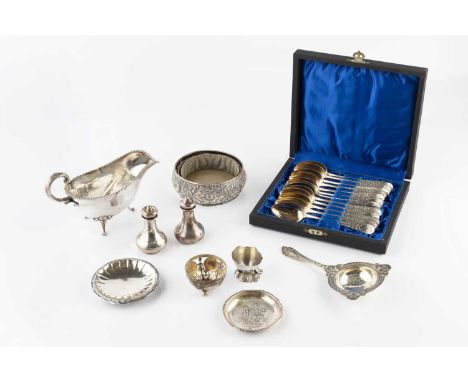A set of twelve late 19th century Scandinavian silver teaspoons, with bright-cut decoration and gilt bowls, by K. Bingen, 189