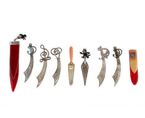 A collection of seven silver bookmarks, by Charles Horner of Halifax, five modelled as scimitars, one as a trowel with coral 