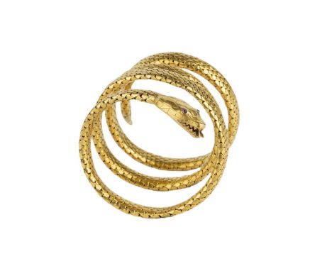 A late 19th century French serpent bracelet, modelled as an expandable coiled snake, highlighted with cabochon ruby eyes, sig