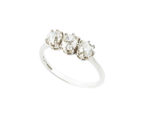 A diamond three stone ring, the cushion-shaped old-cut diamonds in claw setting, white precious metal mounted, stamped 'PLATI