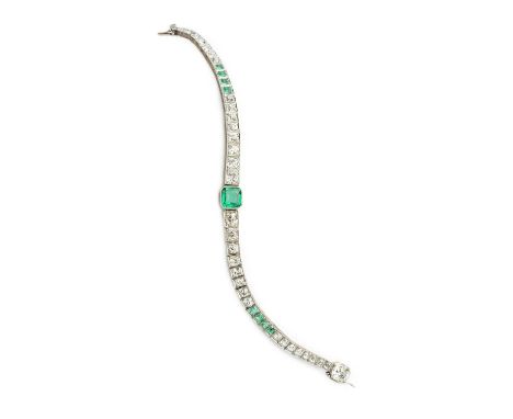 An Art Deco emerald and diamond line bracelet, the principal octagonal step-cut emerald in millegrain collet setting, to a gr