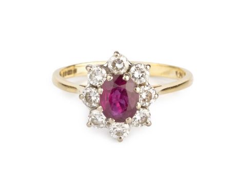 A ruby and diamond cluster ring, the oval mixed-cut ruby claw set within a surround of round brilliant-cut diamonds, 18ct two