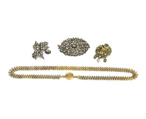 An Austro-Hungarian vari gem-set pendant/brooch, the openwork scrolled cartouche applied with a bird with outstretched wings,