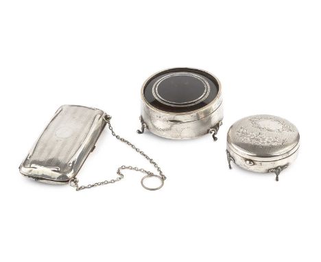 An Edwardian silver circular trinket box, with engine turned and foliate engraved hinged lid, on shaped feet, by Sydney &amp;