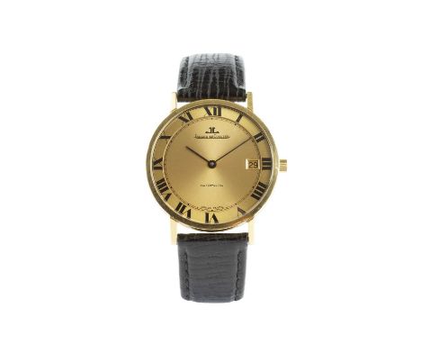 An 18ct gold automatic wristwatch by Jaeger-LeCoultre, the circular gilt dial with black Roman numerals, inner minute track a