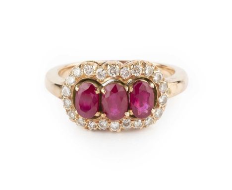 A ruby and diamond triple cluster ring, the trio of oval mixed-cut rubies claw set within a border of round brilliant-cut dia