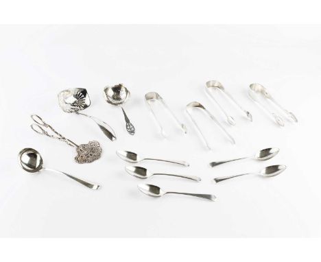 A collection of silver flatware, comprising four pairs of 19th century sugar tongs, a set of five Georgian teaspoons, a Hanov