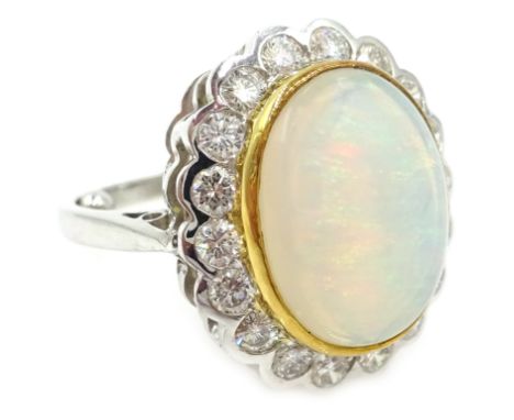 Opal and diamond white gold cluster ring hallmarked 18ct Condition Report Approx 9.3gm, size K, opal = 1.5cm x 1.1cm Click he