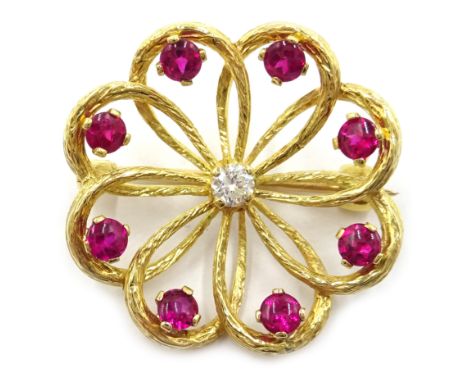 Ruby and diamond 18ct gold openwork flower brooch, rubies approx 1 carat Condition Report Approx 5gm, diameter = 2.5cm Click 