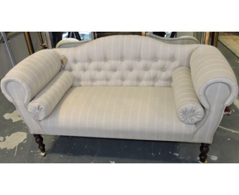 A small Victorian-style sofa, upholstered in natural striped fabric with button back, the turned legs ending in casters, W. 1