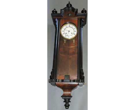 An early 20th century Vienna regulator style wall clock, with walnut and ebonised case, the white enamel dial set out with Ro