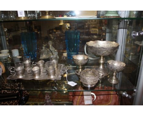 An Eastern or Persian engraved silverplated tray together with four similar dishes and demi tasse cups.