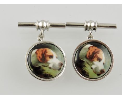 A pair of circular silver chain and bar cufflinks decorated with beagle heads.