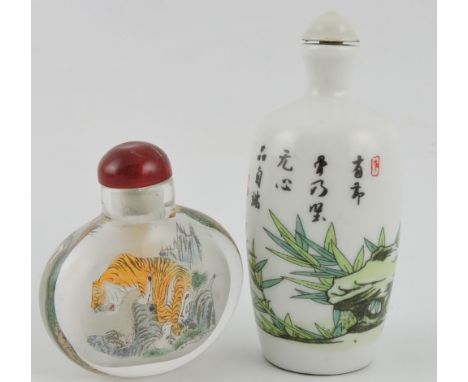 A Chinese interior decorated glass scent bottle together with a ceramic bottle with bamboo shoot decoration.