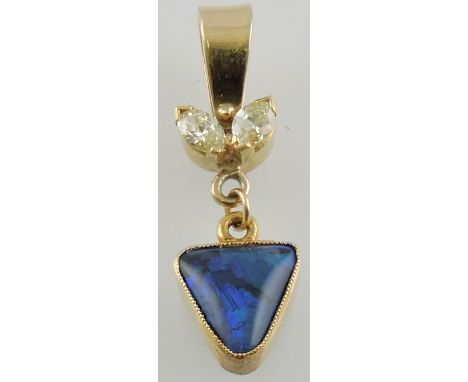 A trillian cut opal and diamond pendant, on yellow metal, 1.5g.