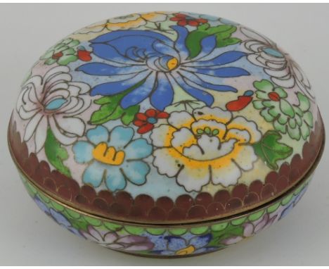 A circular cloisonne lidded box, with stylised floral design, together with a paperknife in the form of a Roman short sword, 