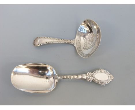 A Victorian hallmarked silver caddy spoon, Birmingham 1868 maker George Unite, length 10cm and a Georgian example, marks rubb