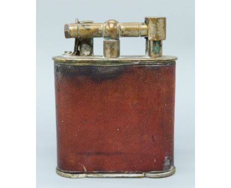 A large plated and leather effect table lighter with various patent marks for European countries including England (286838/27