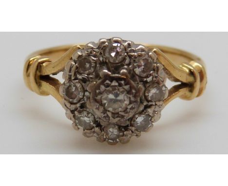 An 18ct gold ring set with diamonds in a cluster, 4g (size M)