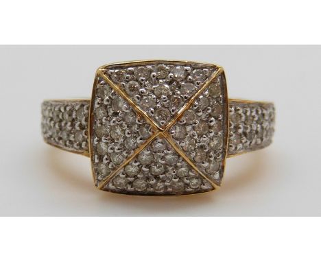 An 18ct gold ring set with diamonds in a large square cluster, total diamond weight approximately 0.7ct, 9.2g (size O)