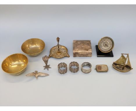 A hallmarked silver hammered cigarette box, filligree items, desk barometer, brass items etc