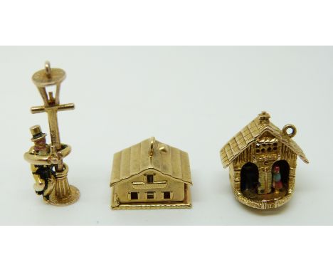 A 9ct gold charm in the form of a house, a 9ct gold charm in the form of a chapel and a 9ct gold charm in the form of a man d