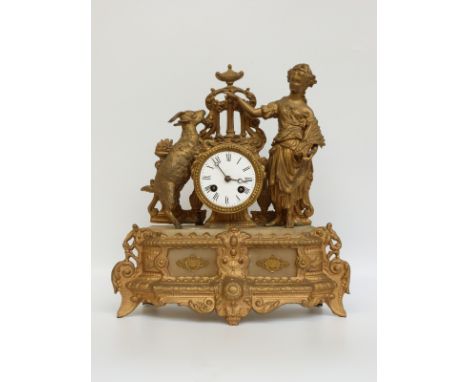 A 19thC ormolu cased marble cased mantel clock, the drum cased movement with goatherd girl and standing goat on either side, 