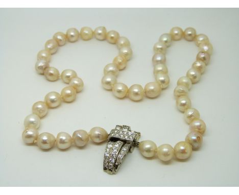 A single strand cultured pearl necklace with 18ct white gold clasp set with diamonds 
