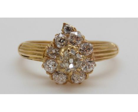 An 18ct gold Victorian ring set with old cut diamonds in the form of a heart, the centre diamond approximately 0.25ct (size O