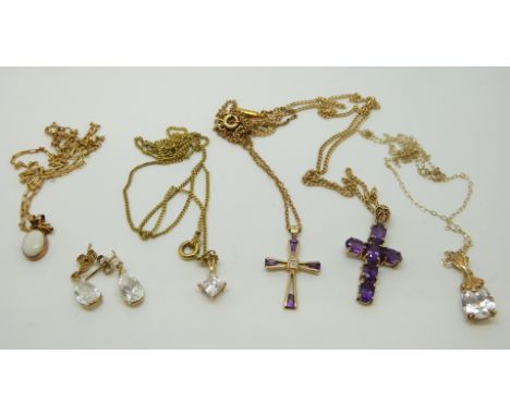 Two 9ct gold crosses with amethysts, four 9ct gold chains, a 9ct gold pendant set with an opal, a 14ct gold pendant set with 