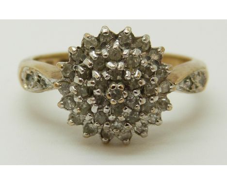 A 9ct gold ring set with diamonds in a cluster, total diamond weight approximately 0.33ct, 2.68g (size K) 