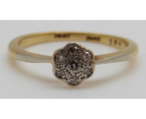 An 18ct gold ring set with diamonds in a platinum setting, 2.8g (size O)