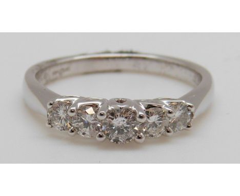 An 18ct white gold ring set with five diamonds totalling approximately 0.5ct,3.6g (size L/M)