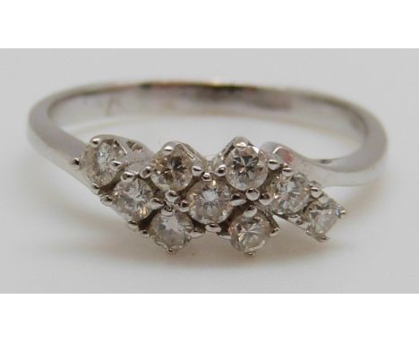 A 14ct white gold ring set with diamonds, 2.3g (size M)