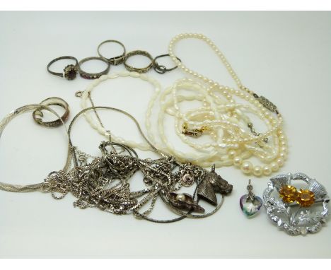 A collection of silver jewellery to include necklaces, pearl necklaces, silver rings, silver bracelet etc.