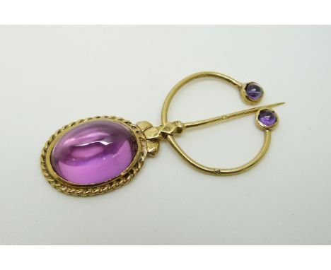 A gold scarf pin set with amethyst cabochons, marks indistinct, 5.8 x 2.cm