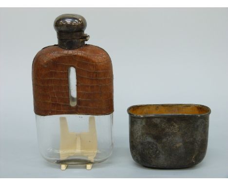 A Victorian hallmarked silver hip flask, part crocodile skin covered, with bayonet cap and pull off cup, Birmingham 1892, mak