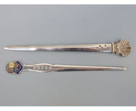 An Irish hallmarked silver letter opener with shell finial bearing import marks and Royal Irish Silver Co mark, length 19cm, 