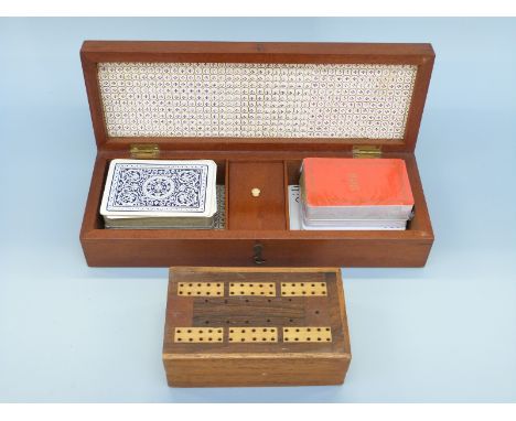 Two inlaid cribbage boards, the largest with cards, both with markers and dice, largest 28cm long 