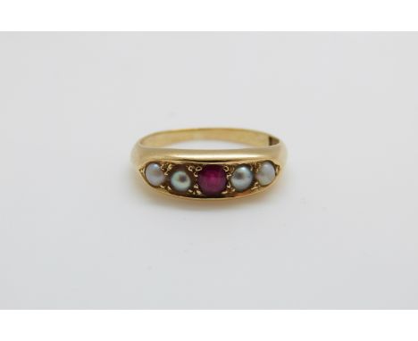 An 18ct gold ring set with a ruby and pearls, 3.8g, size J 