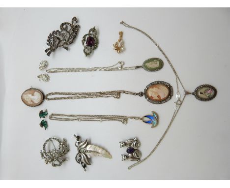 A collection of silver jewellery to include silver brooches, amethyst brooches, cameos, Wedgwood pendant etc